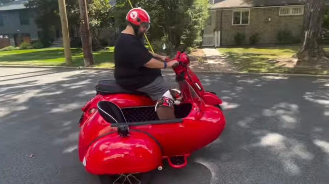 sharing the joy of the road with his best friend